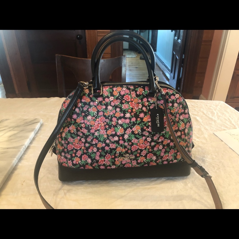 Black and pink floral Coach purse